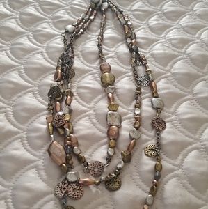 Multi strand earth tone necklace.